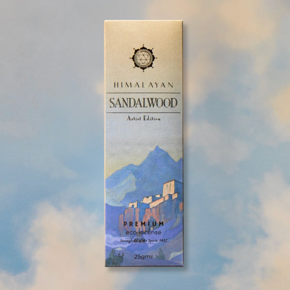 Himalayan Sandalwood incense packaging with mountain design on a soft focus background
