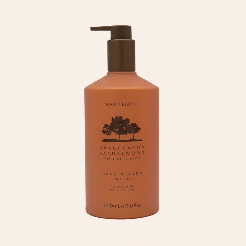 Brown bottle of Maine Beach Rangelands Vandalwood Hand & Body Wash on a beige background