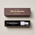 Grounded ritual oil with packaging on a beige background