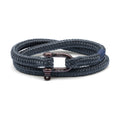 Navy braided bracelet with bronze clasp on a white background