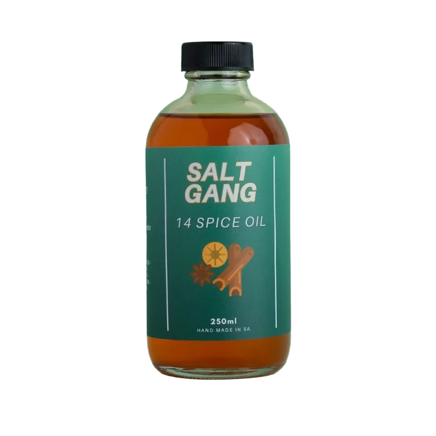Bottle of Salt Gang 14 Spice Oil on a light green background