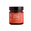 Jar of Salt Gang Hot Honey Crisp on an orange background