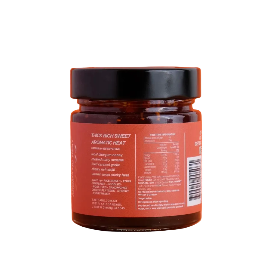 Jar of spicy sauce with label on an orange background