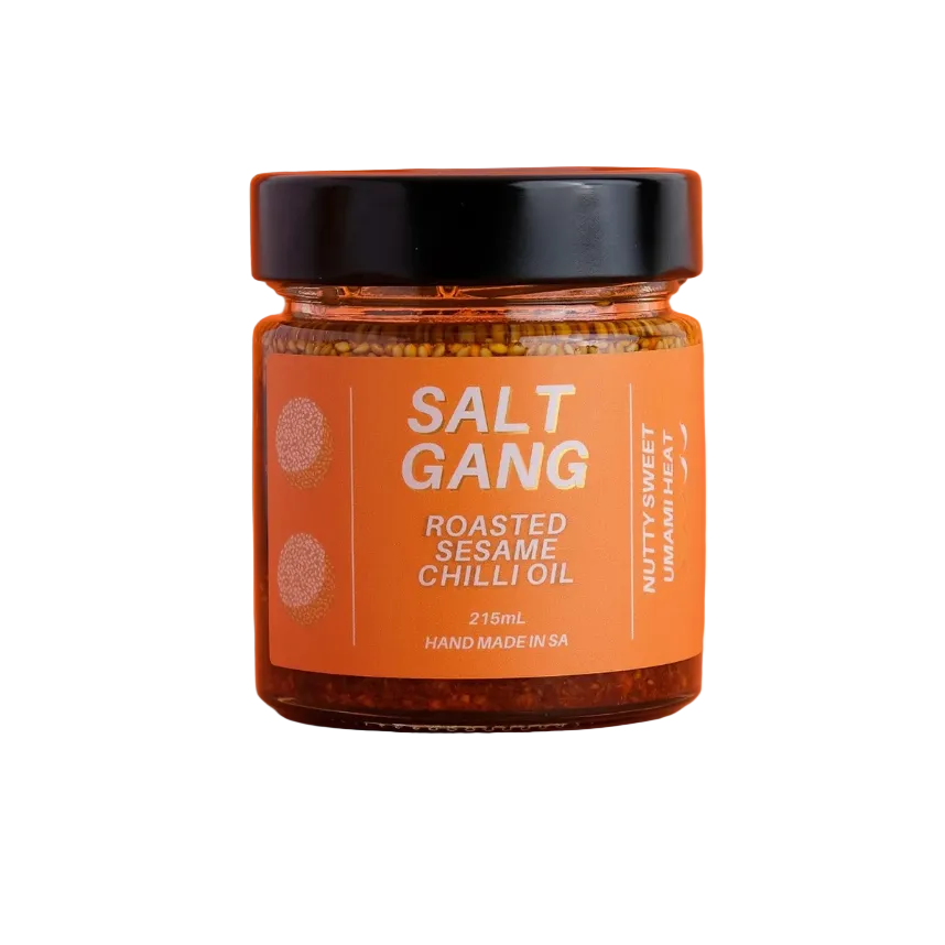 Jar of Salt Gang roasted sesame chilli oil on an orange background