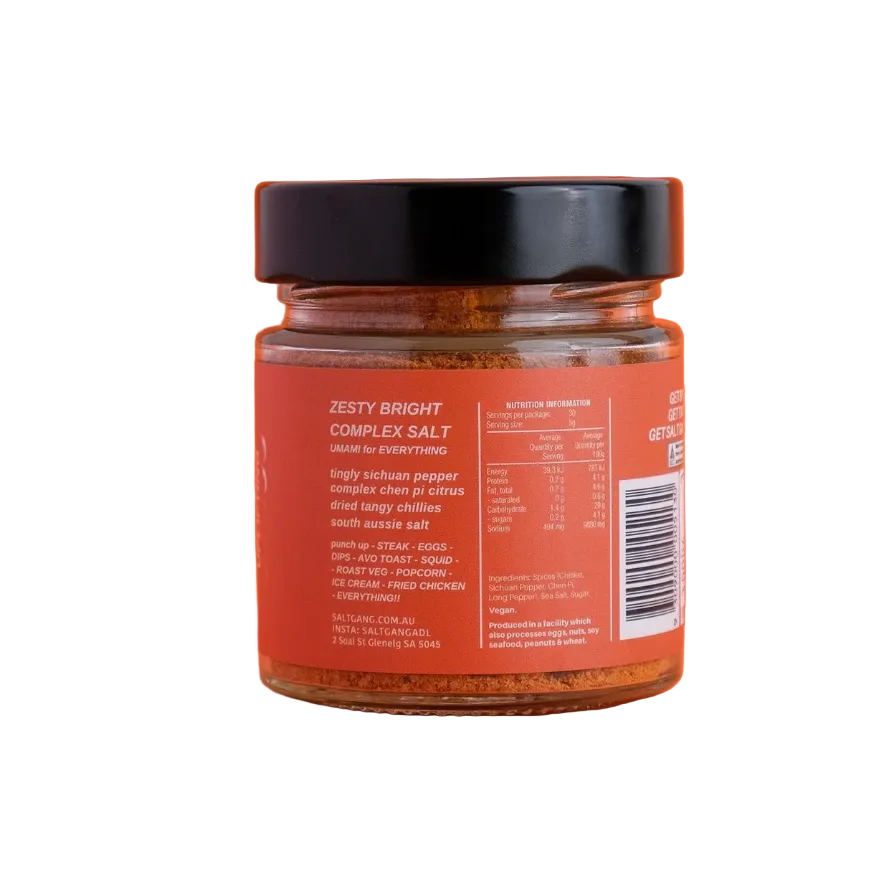 Jar of 'Zesty Bright Complex Salt' on an orange background