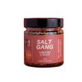 Jar of 'Salt Gang Umami Crisp' on a red background