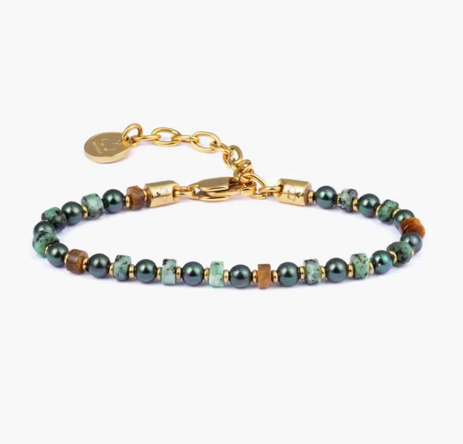 Bracelet with green beads and gold accents on a white background