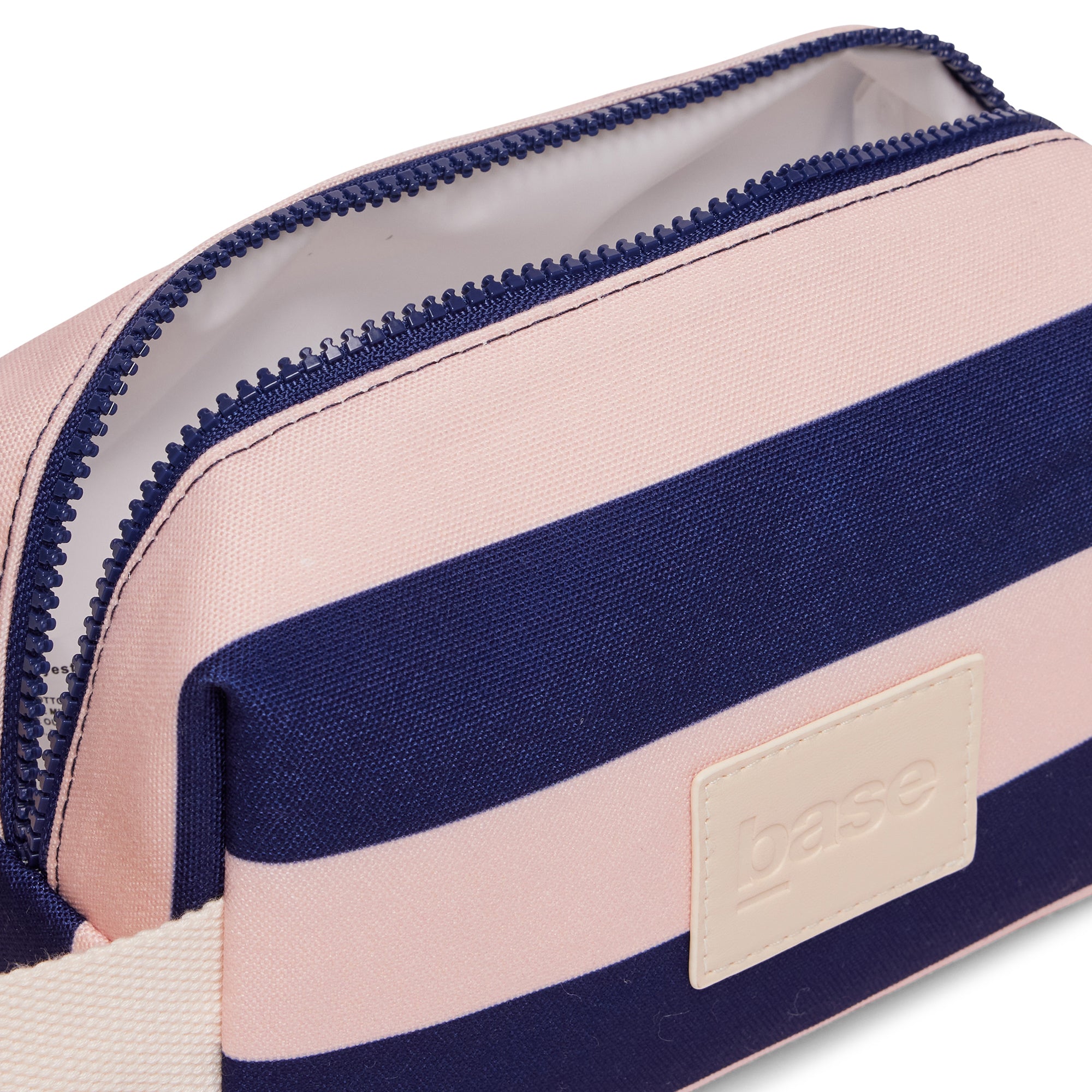 Striped pouch with navy and pink design, featuring a visible brand logo.