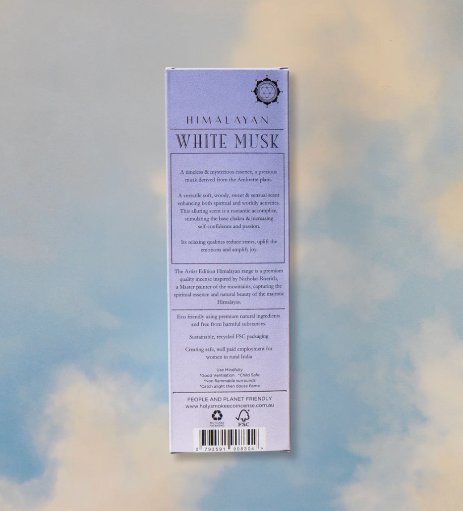 Himalayan White Musk product packaging with text on a blurred natural background