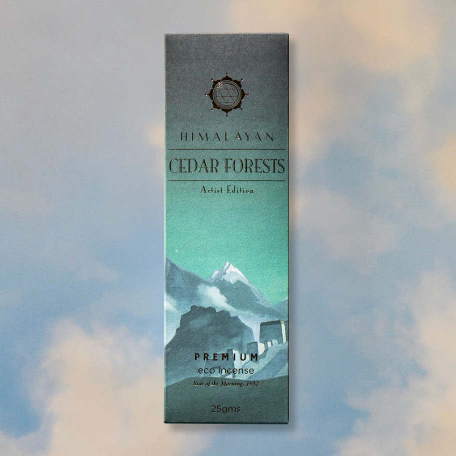 Himalayan Cedar Forests incense packaging with mountain design on a soft focus background