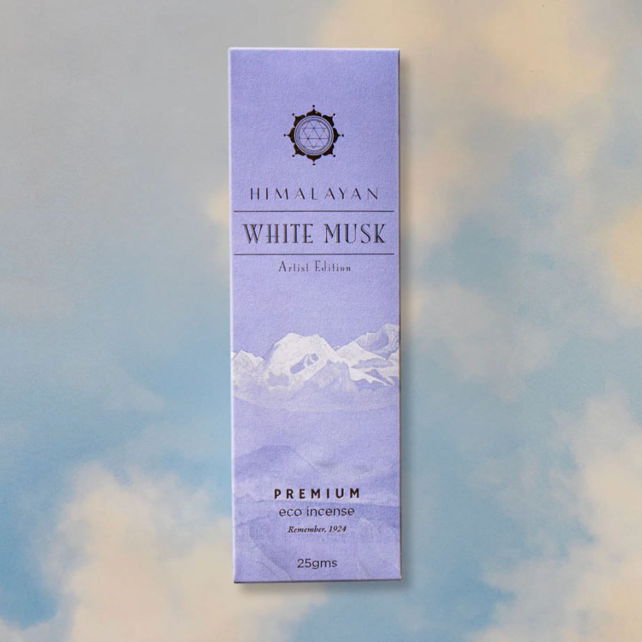 Himalayan White Musk incense packaging with mountain design on a blurred background
