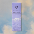 Himalayan White Musk incense packaging with mountain design on a blurred background
