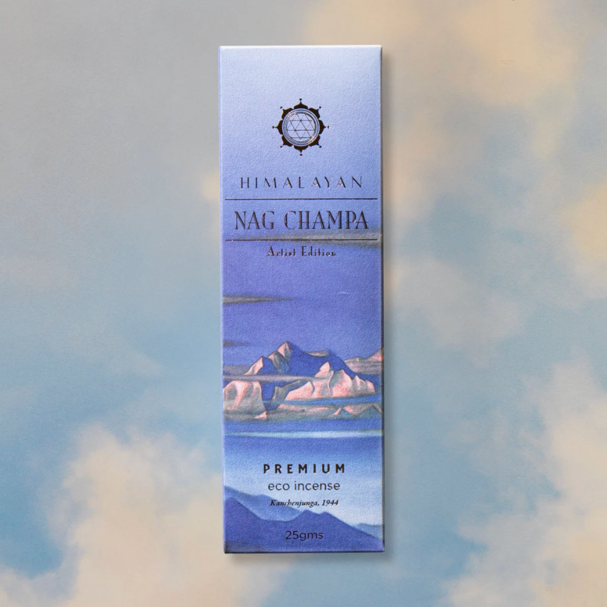 Himalayan Nag Champa incense packaging with mountain design on a blurred background