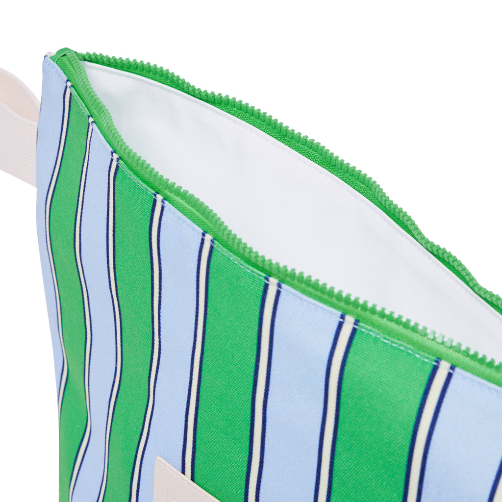 Close-up of a green and blue striped pouch with a zipper.